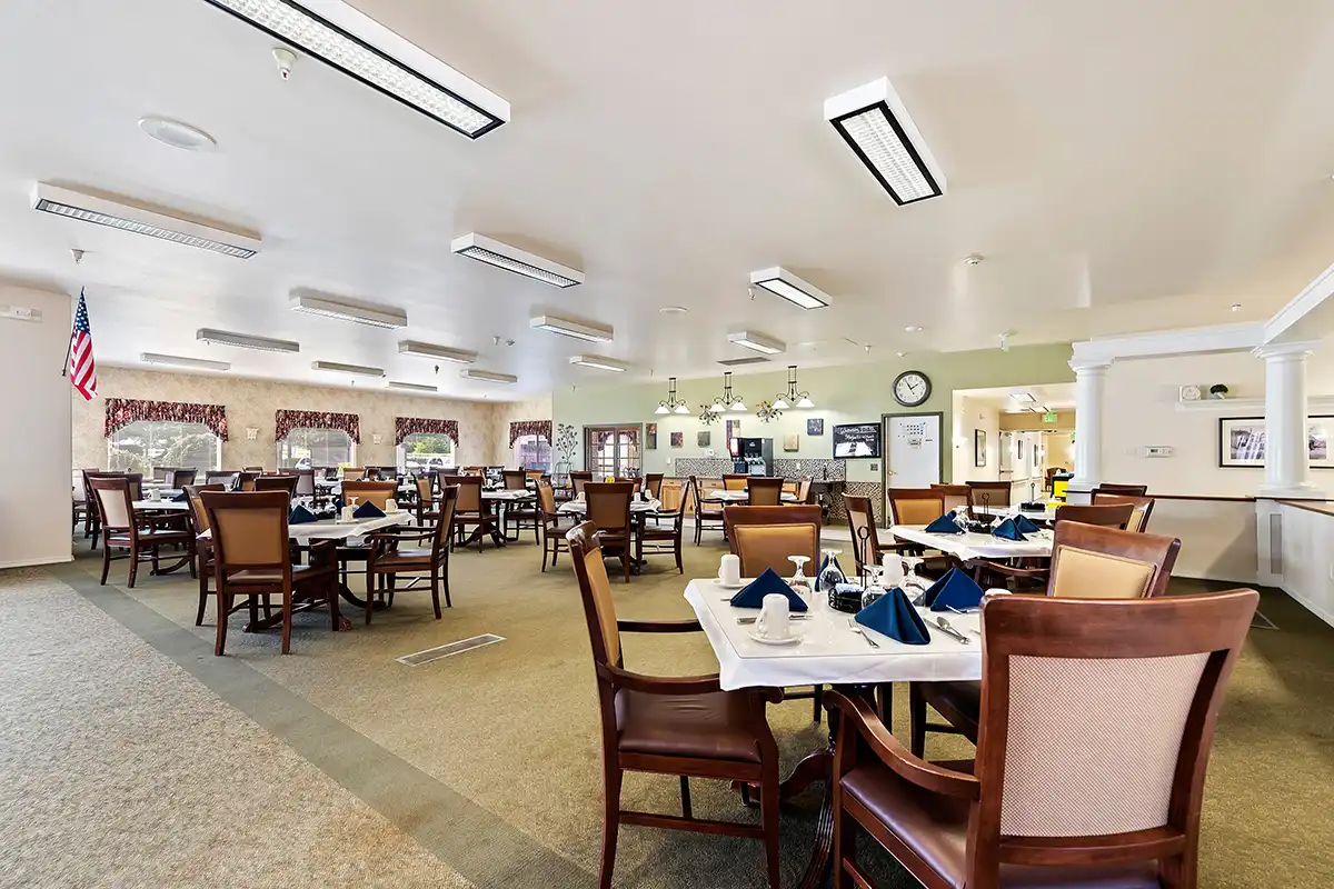 Dining room with chairs and tables at the Autumn Wind Assisted Living & Memory Care facility